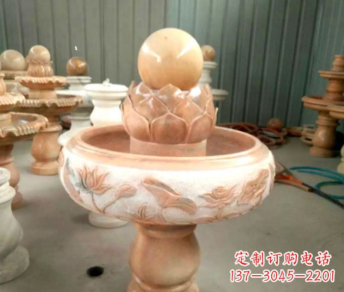 达州石来运转晚霞红风水球喷泉石雕