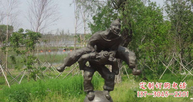 达州园林站在球上面跳山羊的人物景观铜雕